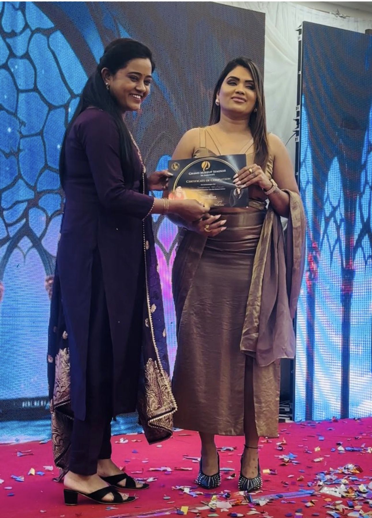Sonali Dalvi receiving a professional makeup artist certificate after completing advanced beauty and bridal makeup training.